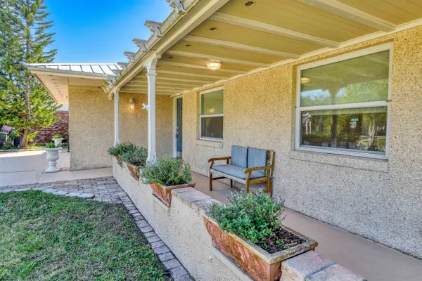a front view of a house with garden