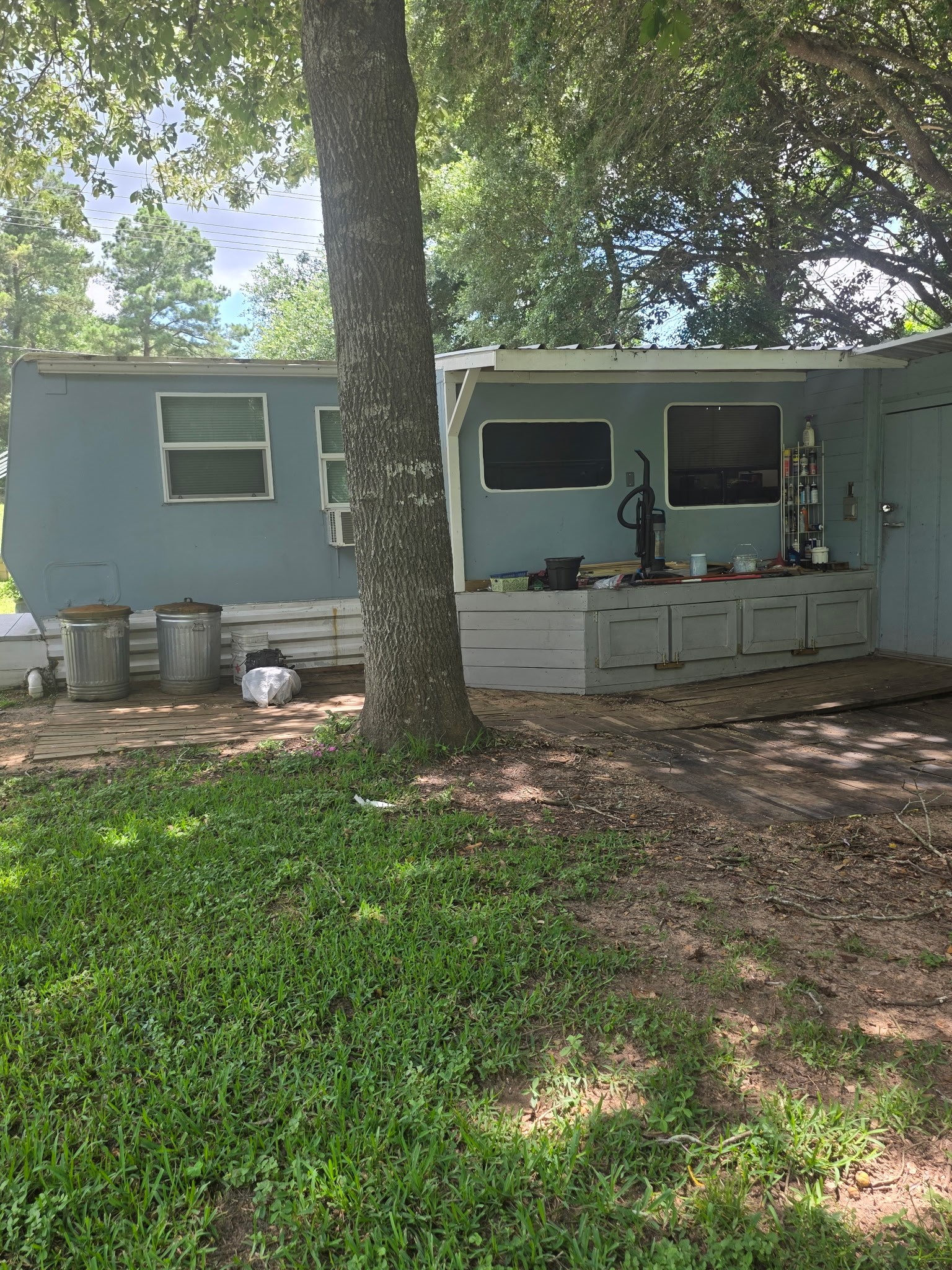 11 Pine Road Coldspring, TX 77331 - Photo 6 of 32 a backyard of a house with table and chairs