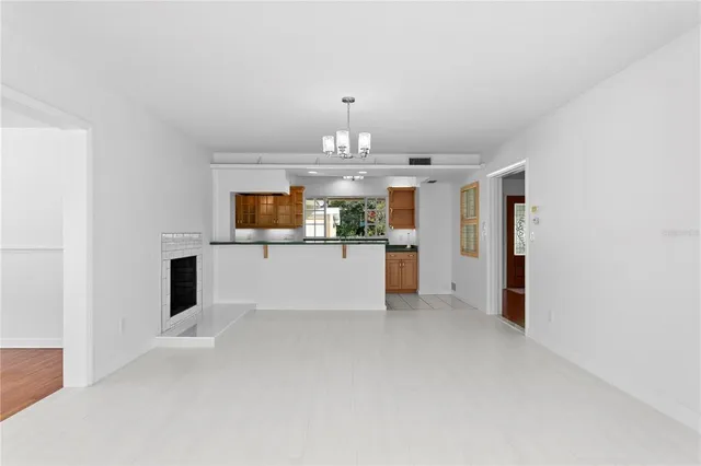 wooden floor in a room next to a window