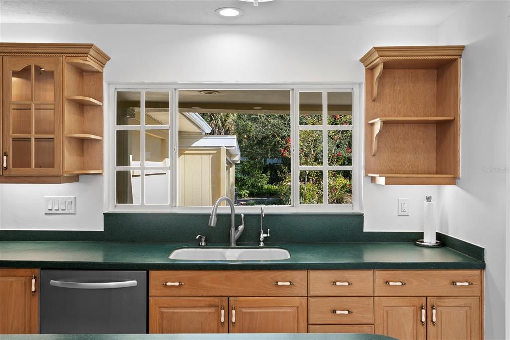234 Driftwood Road Southeast St. Petersburg, FL 33705 - Photo 29 of 66 a kitchen with a sink and a window