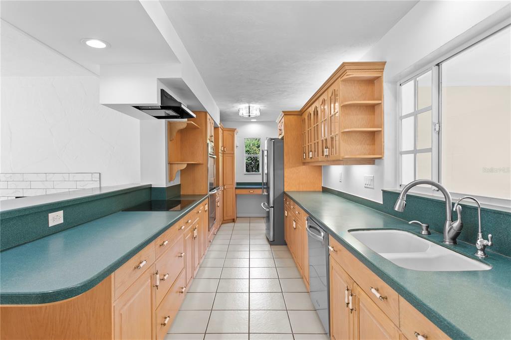 234 Driftwood Road Southeast St. Petersburg, FL 33705 - Photo 30 of 66 a large kitchen with kitchen island a sink stainless steel appliances and a counter space