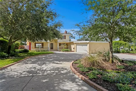 a house with trees in the background