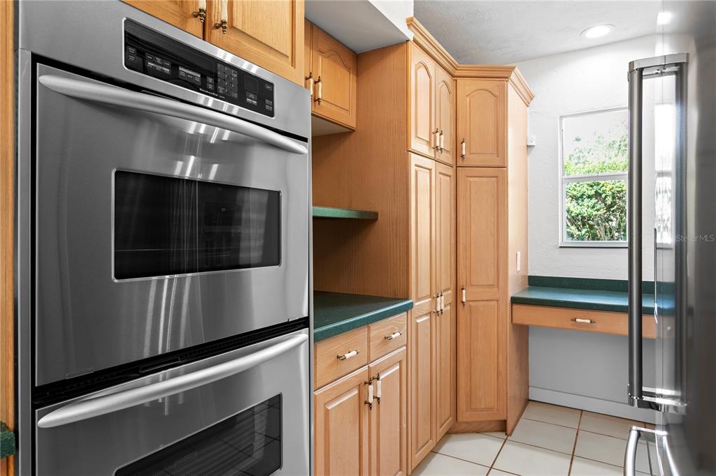 234 Driftwood Road Southeast St. Petersburg, FL 33705 - Photo 33 of 66 a kitchen with stainless steel appliances a refrigerator and cabinets