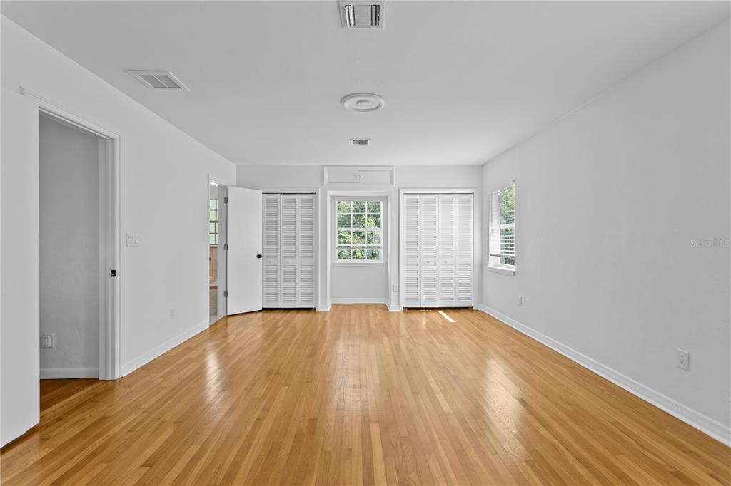 234 Driftwood Road Southeast St. Petersburg, FL 33705 - Photo 39 of 66 a view of an empty room with wooden floor and a window