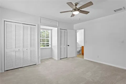 a view of a backyard with large trees