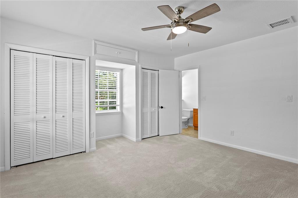 234 Driftwood Road Southeast St. Petersburg, FL 33705 - Photo 47 of 66 a view of an empty room and a ceiling fan & cabinets