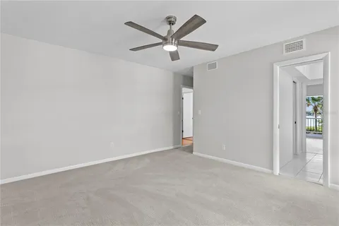 a view of a backyard with swimming pool