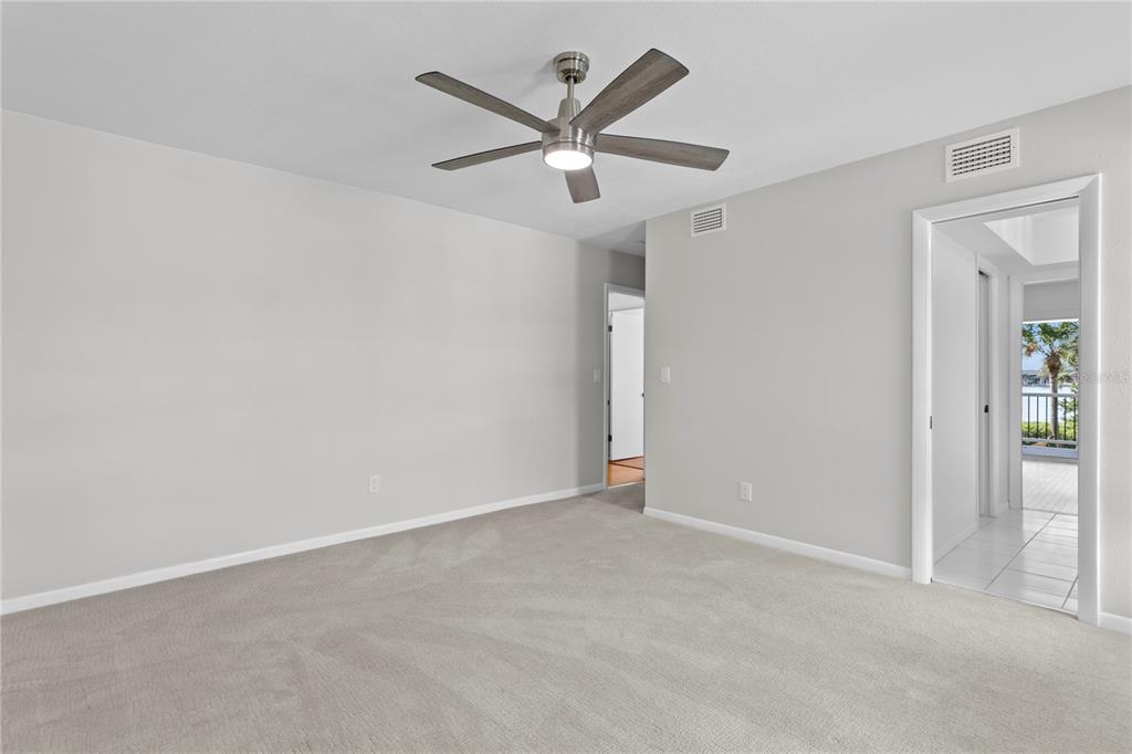 234 Driftwood Road Southeast St. Petersburg, FL 33705 - Photo 49 of 66 an empty room with closet and ceiling fan