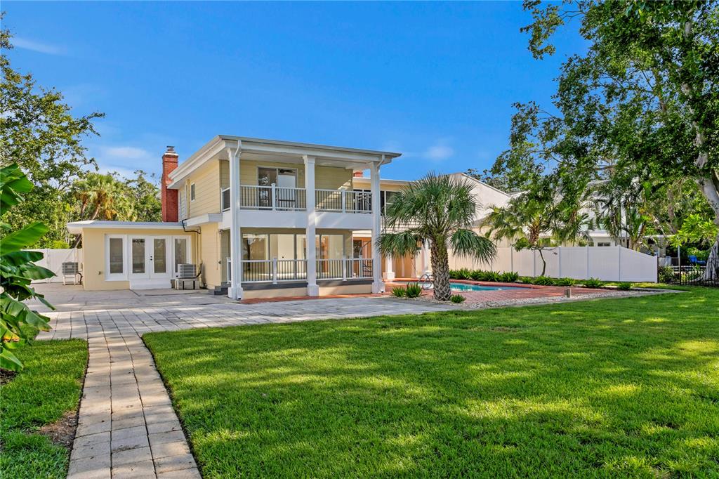 234 Driftwood Road Southeast St. Petersburg, FL 33705 - Photo 5 of 66 a front view of a house with a yard