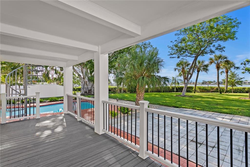 234 Driftwood Road Southeast St. Petersburg, FL 33705 - Photo 51 of 66 a view of a porch with wooden floor and fence