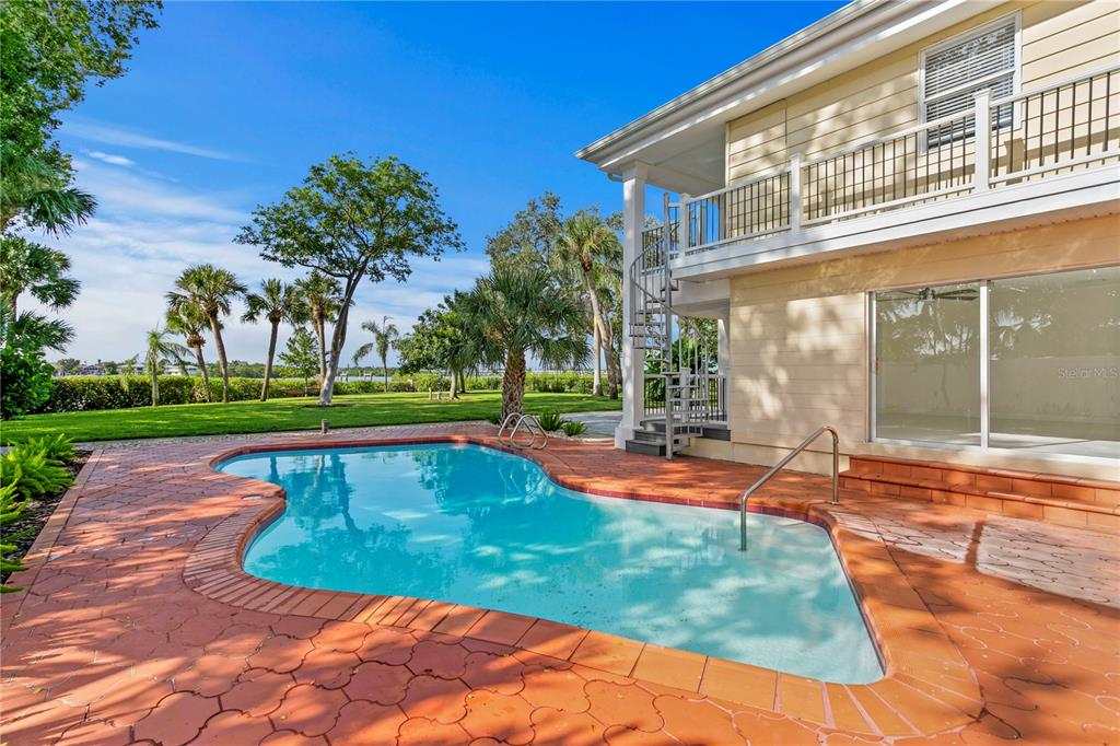 234 Driftwood Road Southeast St. Petersburg, FL 33705 - Photo 58 of 66 a view of a house with a swimming pool