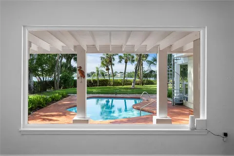 a view of a livingroom with wooden floor and a fireplace