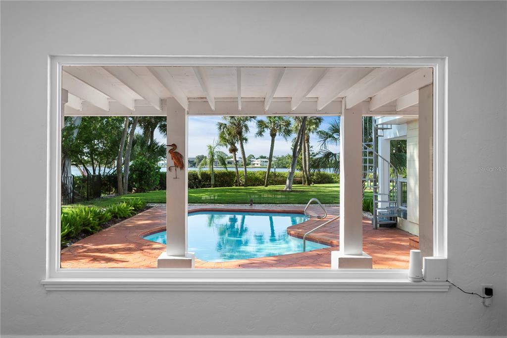 234 Driftwood Road Southeast St. Petersburg, FL 33705 - Photo 6 of 66 a front view of a house with garden and patio