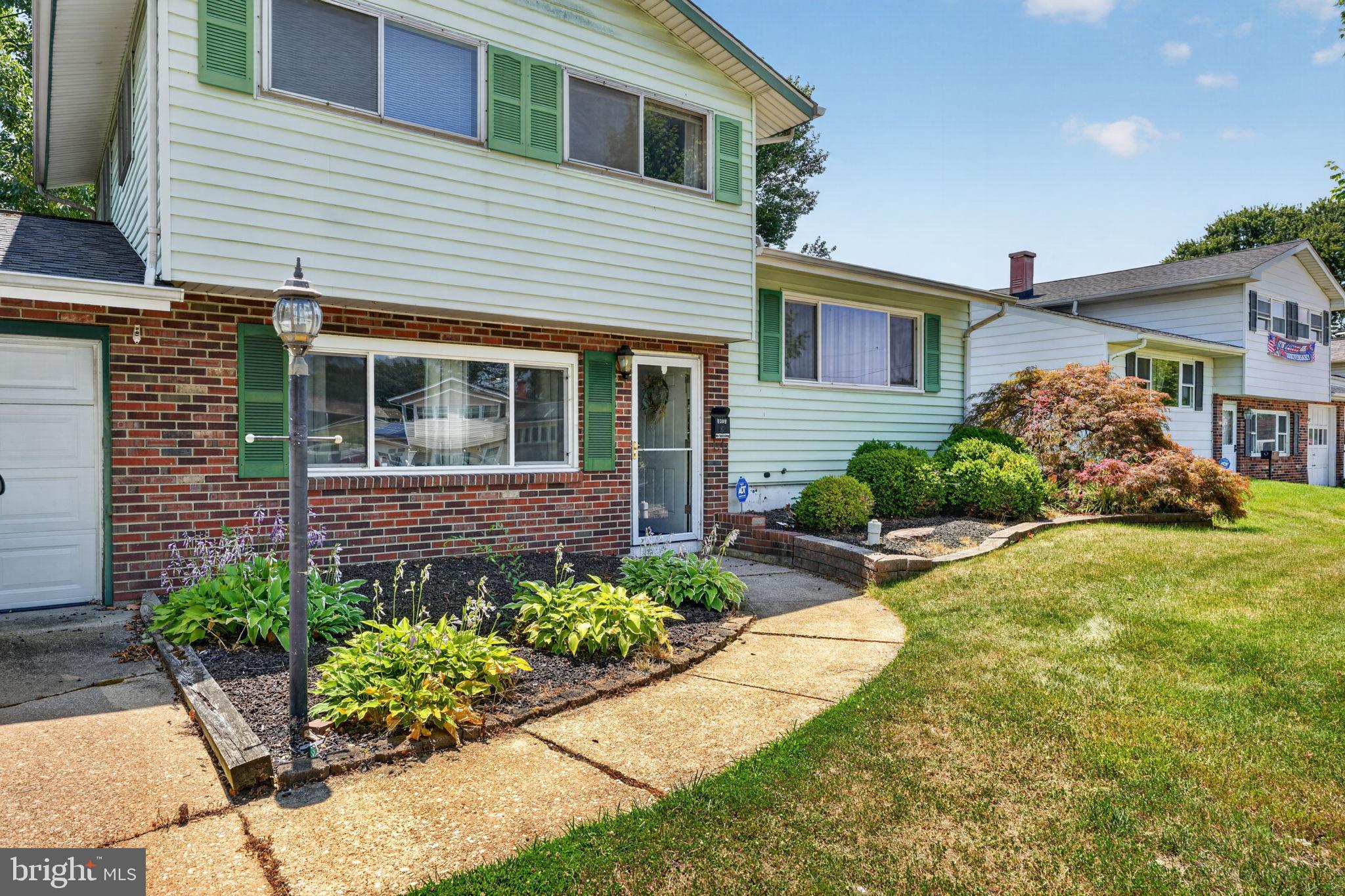 1301 Greentree Road Newark, DE 19713 - Photo 2 of 3 Charming curb appeal with lush gardens.