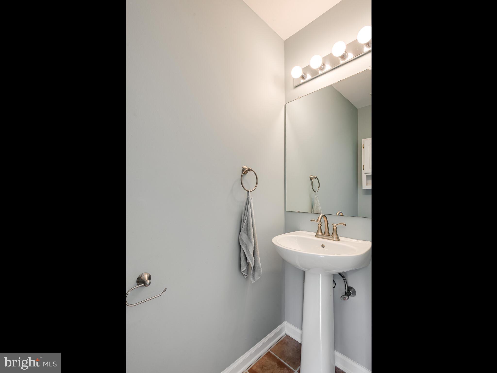 77 Buttonwood Drive, Unit 77 Exton, PA 19341 - Photo 15 of 29 a bathroom with a sink and a mirror