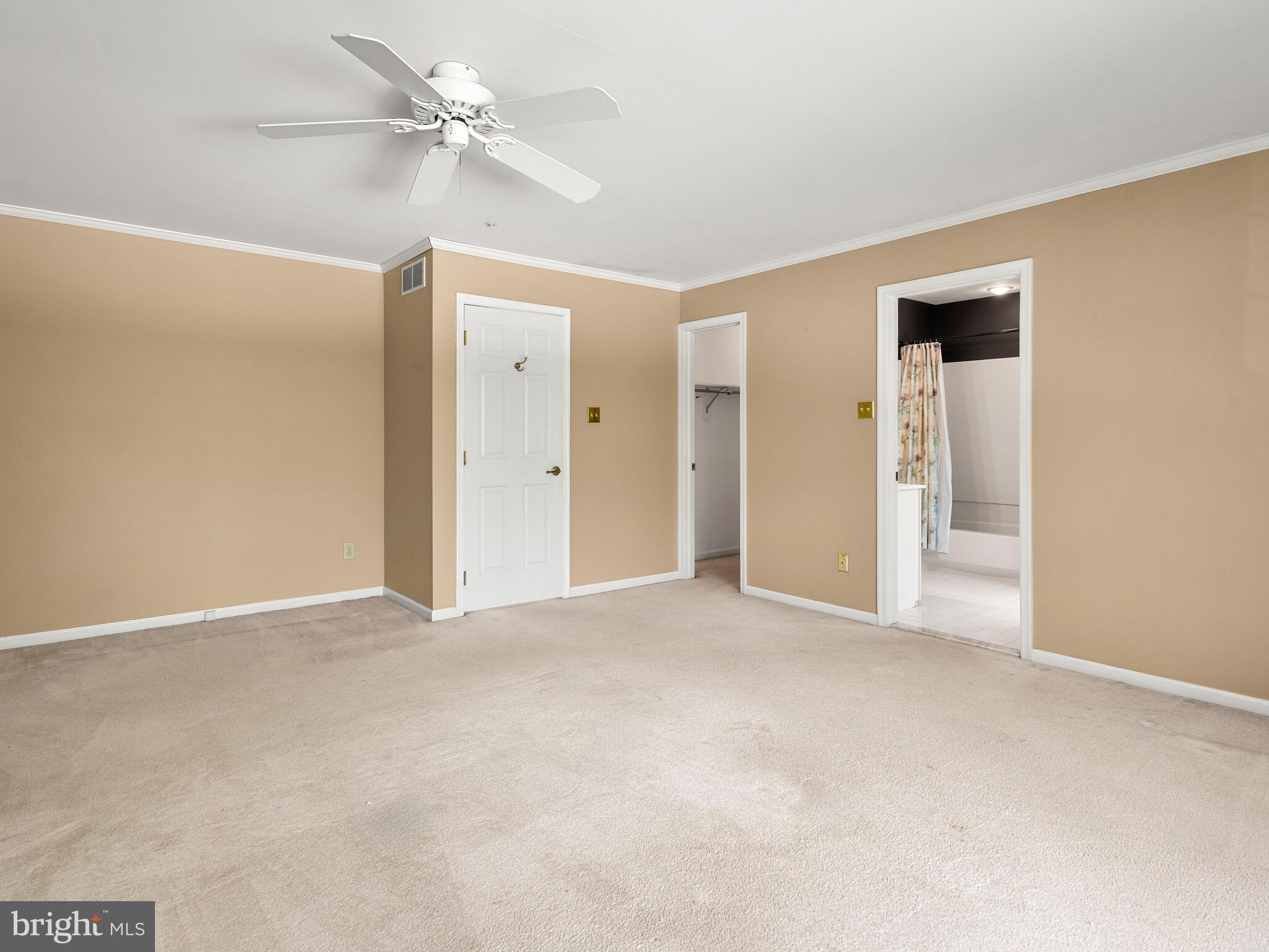 77 Buttonwood Drive, Unit 77 Exton, PA 19341 - Photo 19 of 29 an empty room with fan and entrance