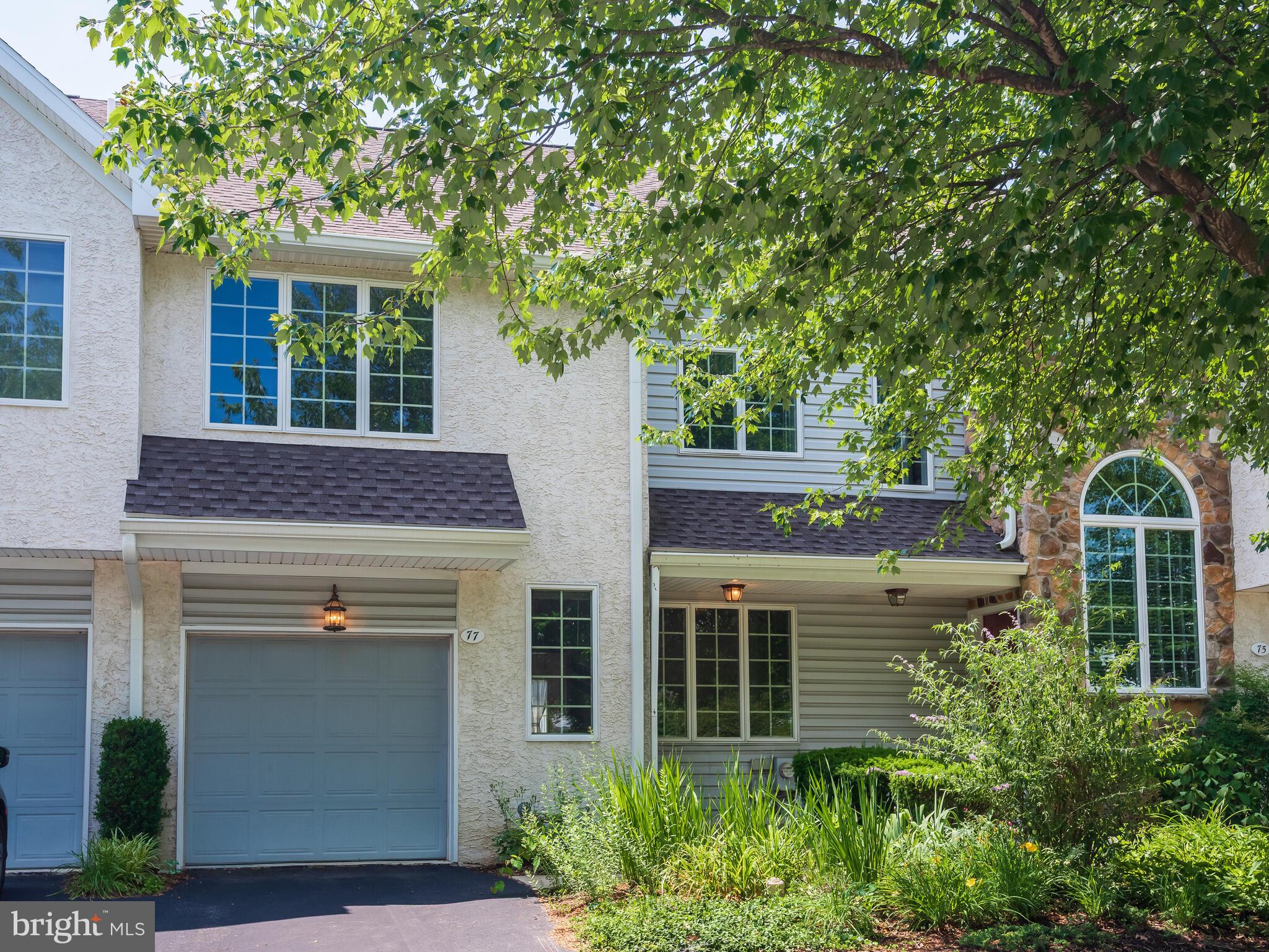 77 Buttonwood Drive, Unit 77 Exton, PA 19341 - Photo 5 of 29 a front view of a house with garden