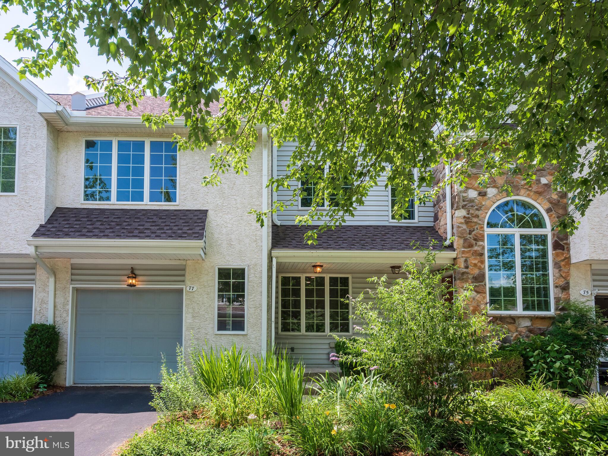 77 Buttonwood Drive, Unit 77 Exton, PA 19341 - Photo 6 of 29 a front view of a house with garden