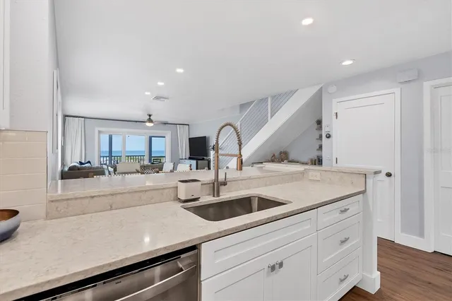 a kitchen with a sink and cabinets