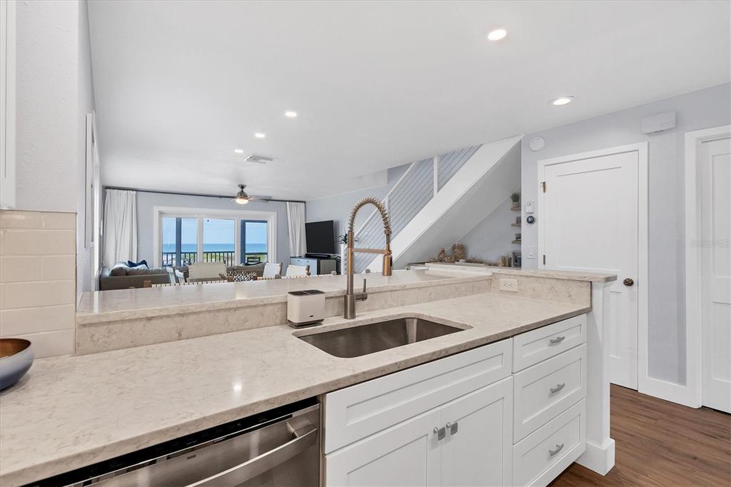 420 Gulf Boulevard, Unit 20 Boca Grande, FL 33921 - Photo 14 of 44 a kitchen with a sink and cabinets