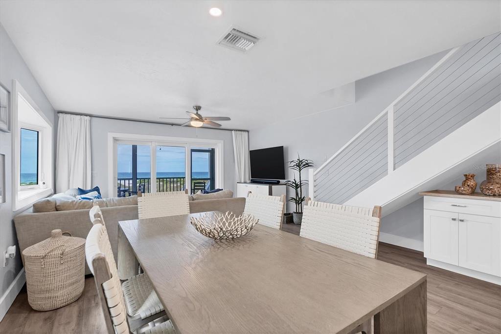 420 Gulf Boulevard, Unit 20 Boca Grande, FL 33921 - Photo 17 of 44 a living room with furniture a large window and a flat screen tv