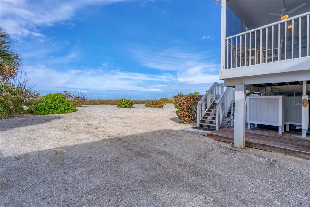 420 Gulf Boulevard, Unit 20 Boca Grande, FL 33921 - Photo 33 of 44 a view of a house with a yard