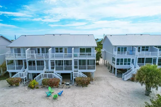 a front view of a residential apartment building with a yard