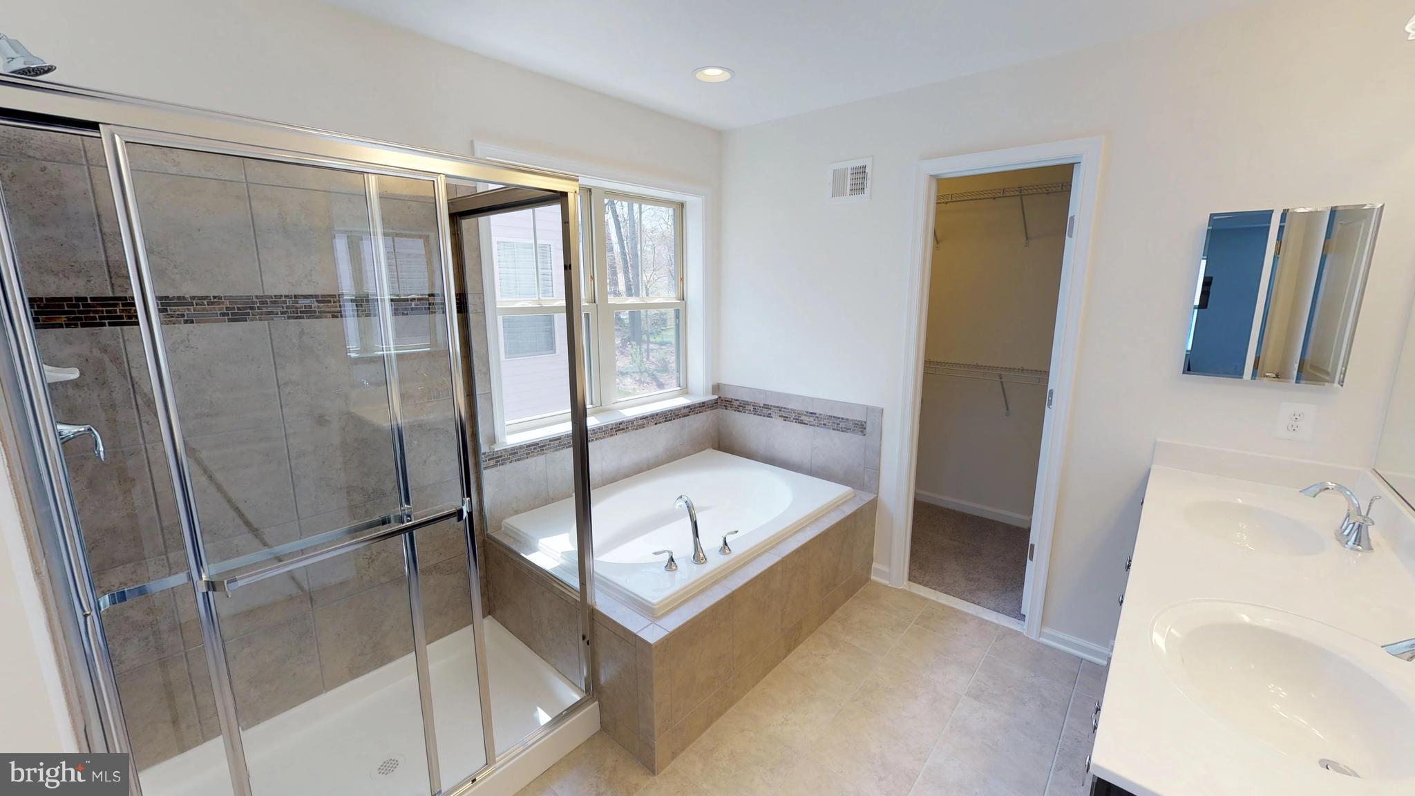 830 Janet Dale Lane Severn, MD 21144 - Photo 14 of 14 a bathroom with a tub and a sink