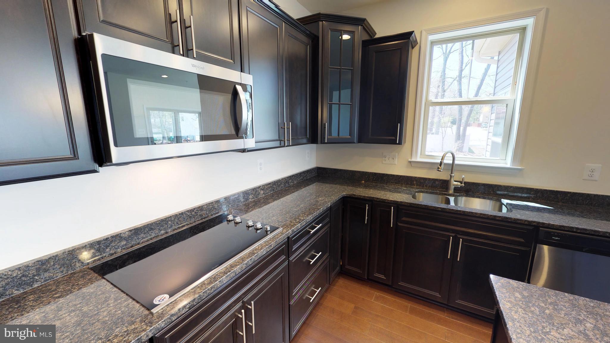 830 Janet Dale Lane Severn, MD 21144 - Photo 6 of 14 a kitchen with a sink stove and cabinets
