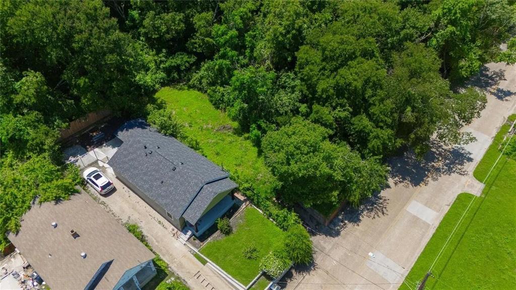 2000 Canyon Street Dallas, TX 75203 - Photo 3 of 5 an aerial view of a house with a yard and greenery
