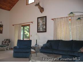 2692 Johnson Hl Road Hop Bottom, PA 18824 - Photo 7 of 8 a living room with furniture and a window
