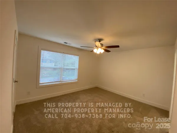 a view of a room that has a window in it