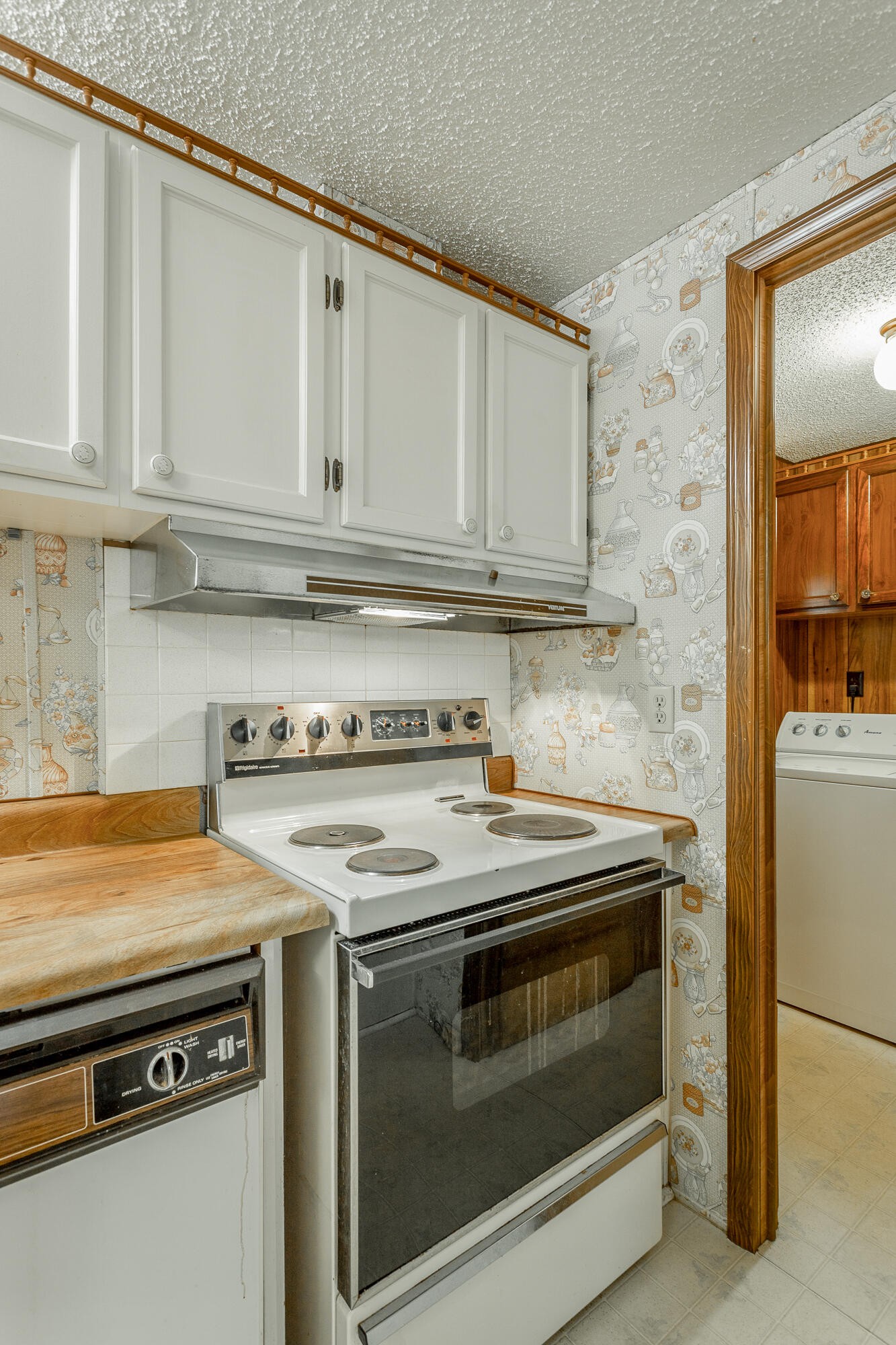 781 East Reed Road LaFayette, GA 30728 - Photo 25 of 73 a kitchen with granite countertop white cabinets and white appliances