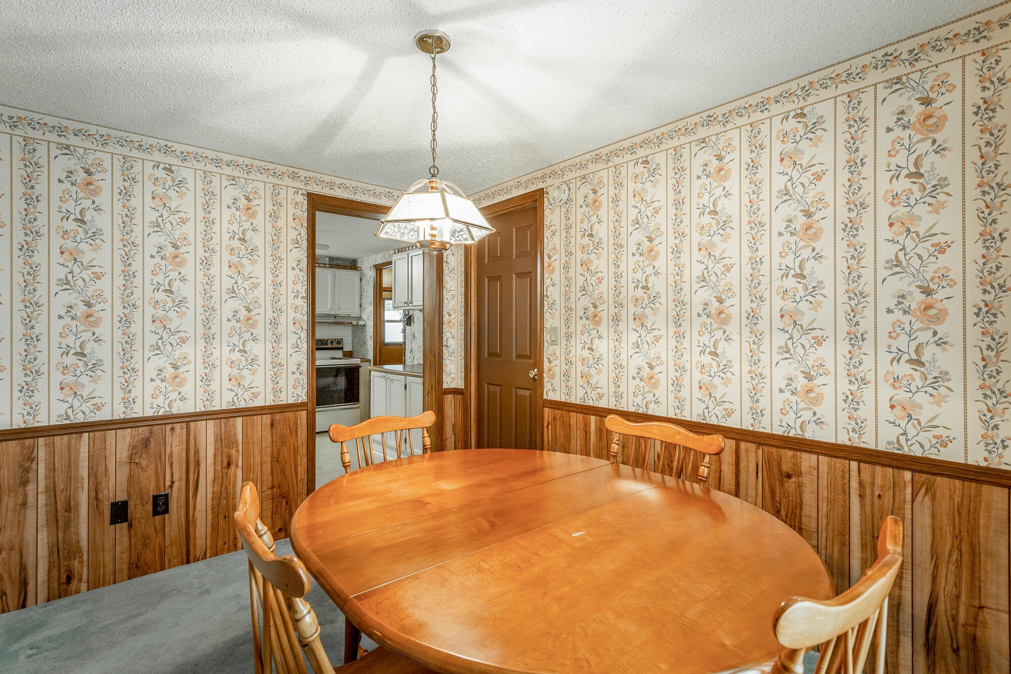 781 East Reed Road LaFayette, GA 30728 - Photo 27 of 73 a bedroom with a bed and a chandelier