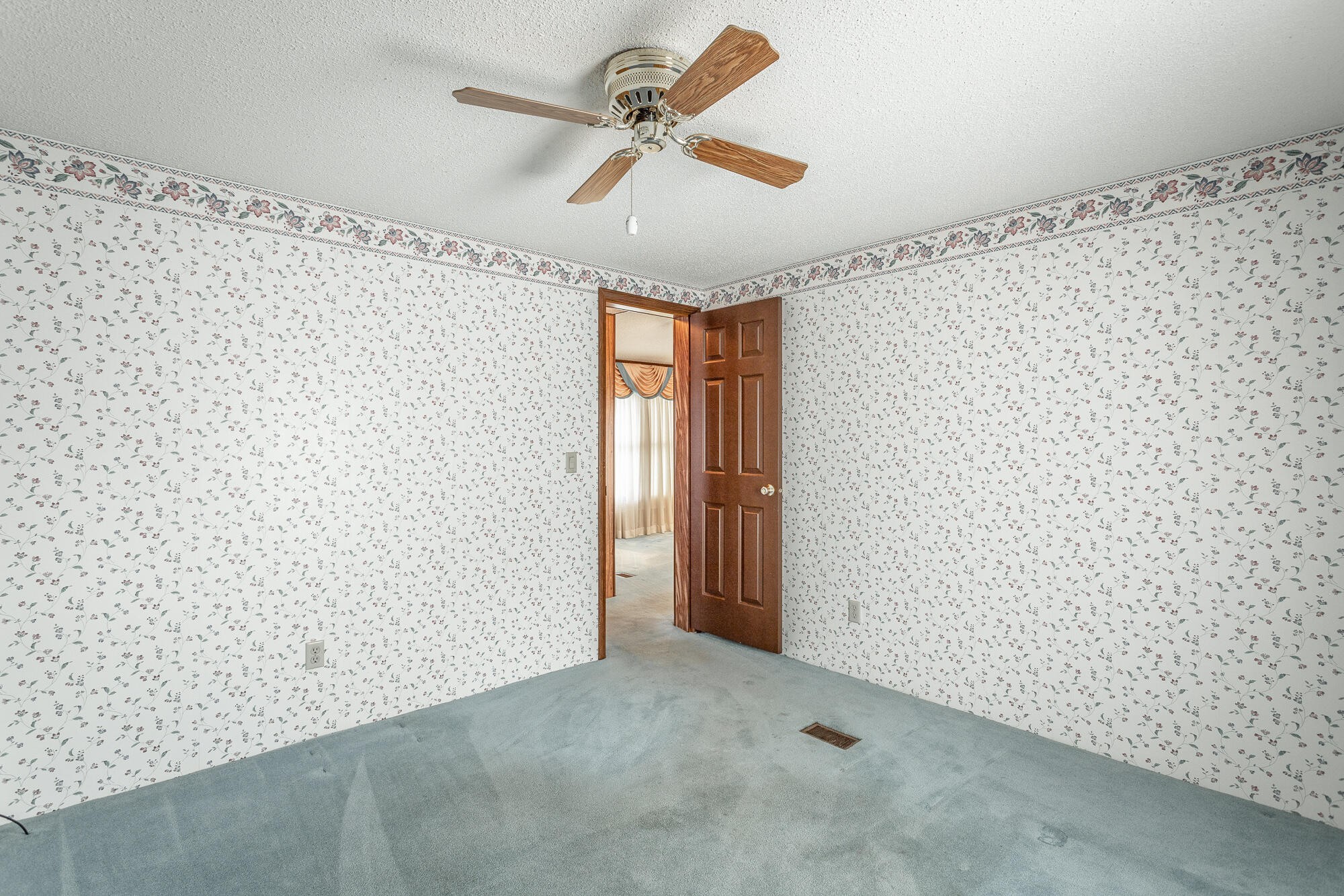 781 East Reed Road LaFayette, GA 30728 - Photo 42 of 73 a view of a room with a ceiling fan and a window