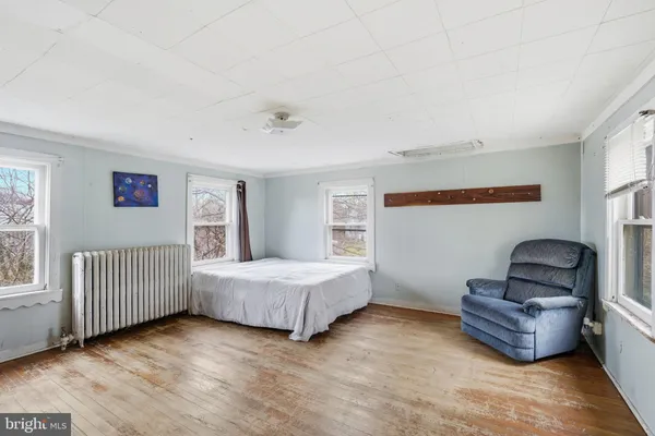 a bedroom with furniture and window