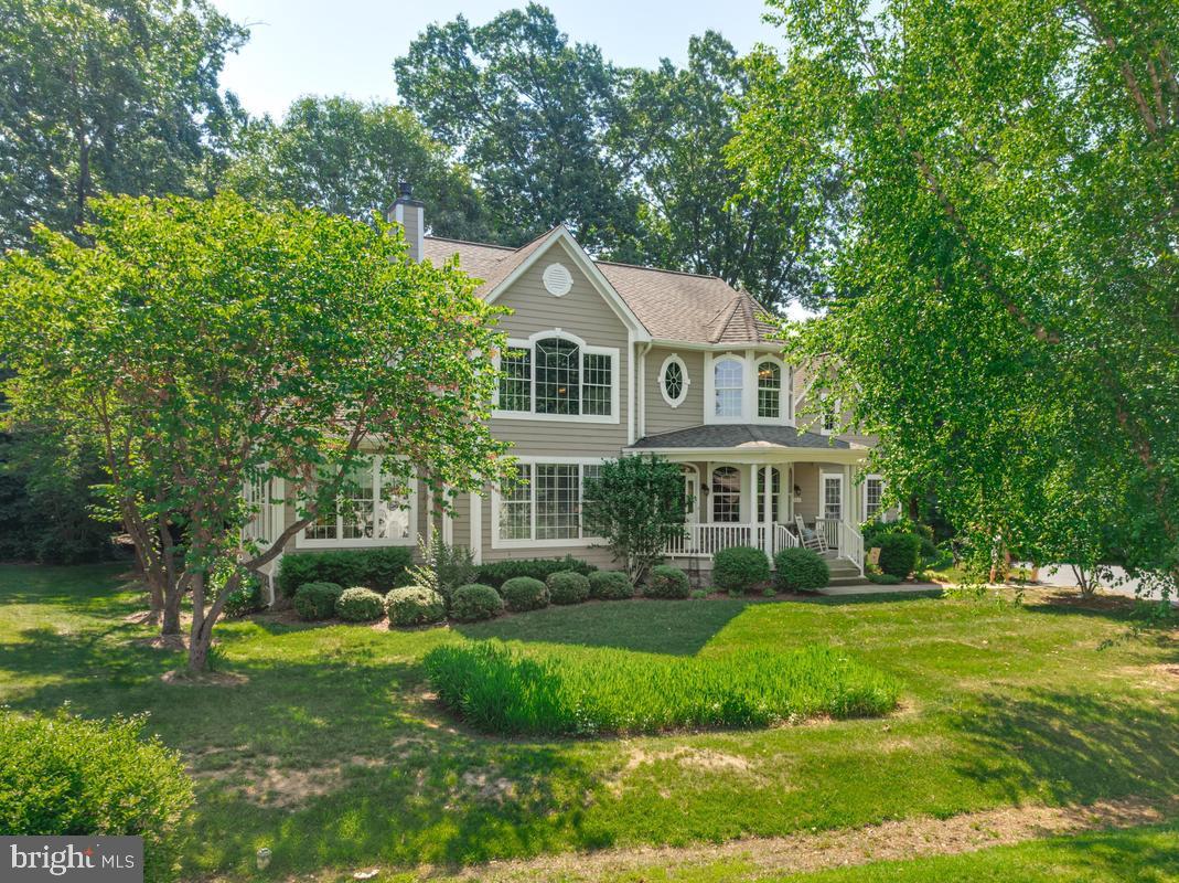 11565 Magnolia Court Issue, MD 20645 - Photo 43 of 68 a front view of a house with a yard
