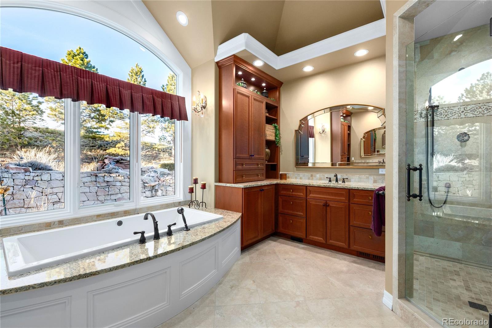 71 North Ranch Road Littleton, CO 80127 - Photo 22 of 40 a large bathroom with a large tub and sink