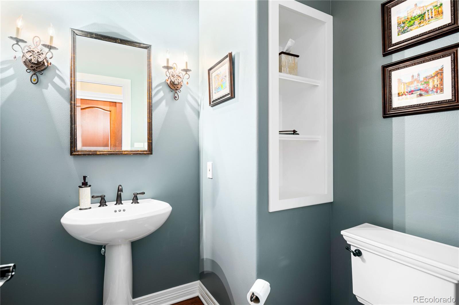 71 North Ranch Road Littleton, CO 80127 - Photo 25 of 40 a bathroom with a toilet sink and mirror