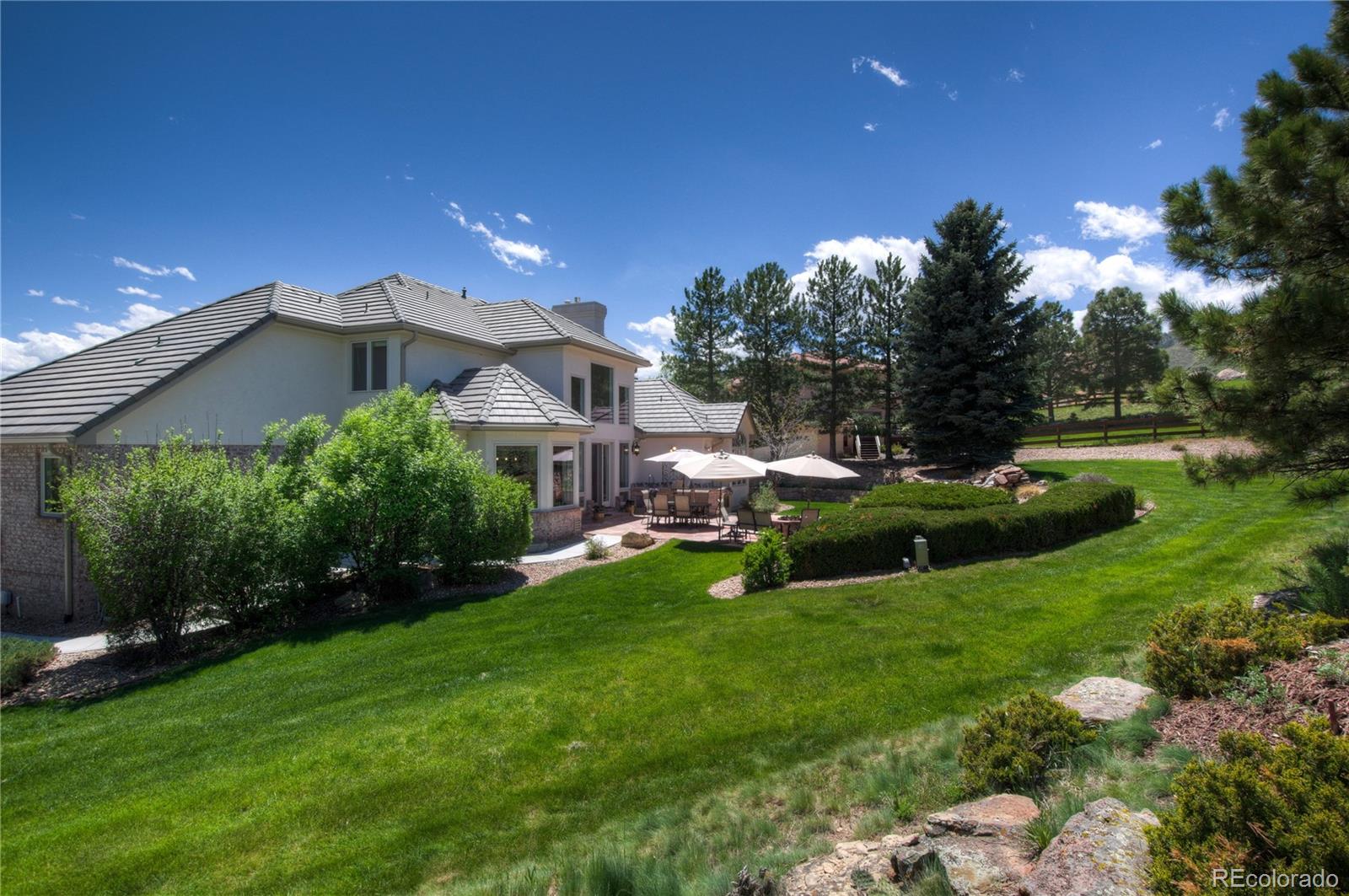 71 North Ranch Road Littleton, CO 80127 - Photo 7 of 40 a view of a house with a yard and sitting area
