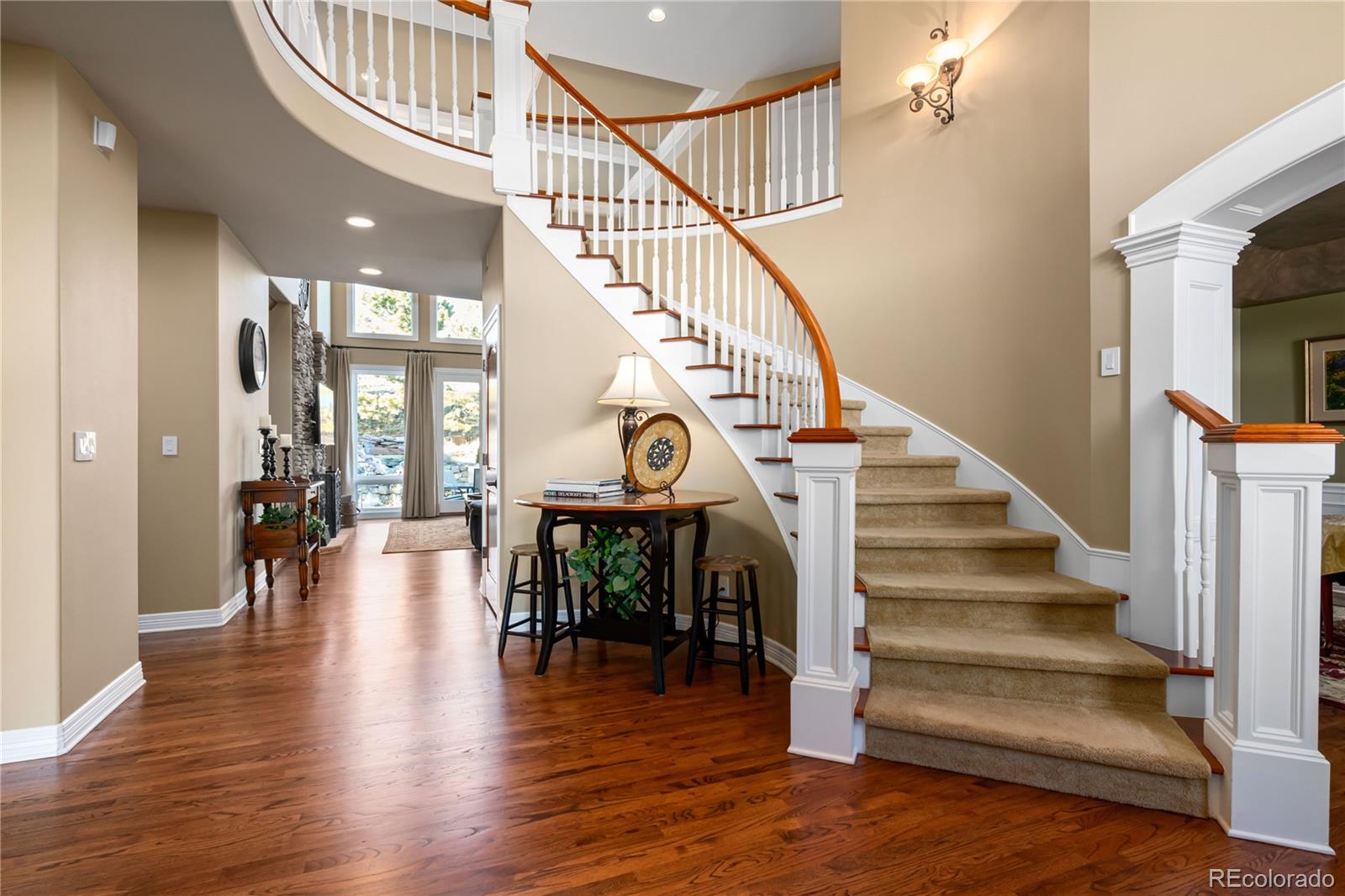 71 North Ranch Road Littleton, CO 80127 - Photo 9 of 40 a view of entryway and hall with wooden floor