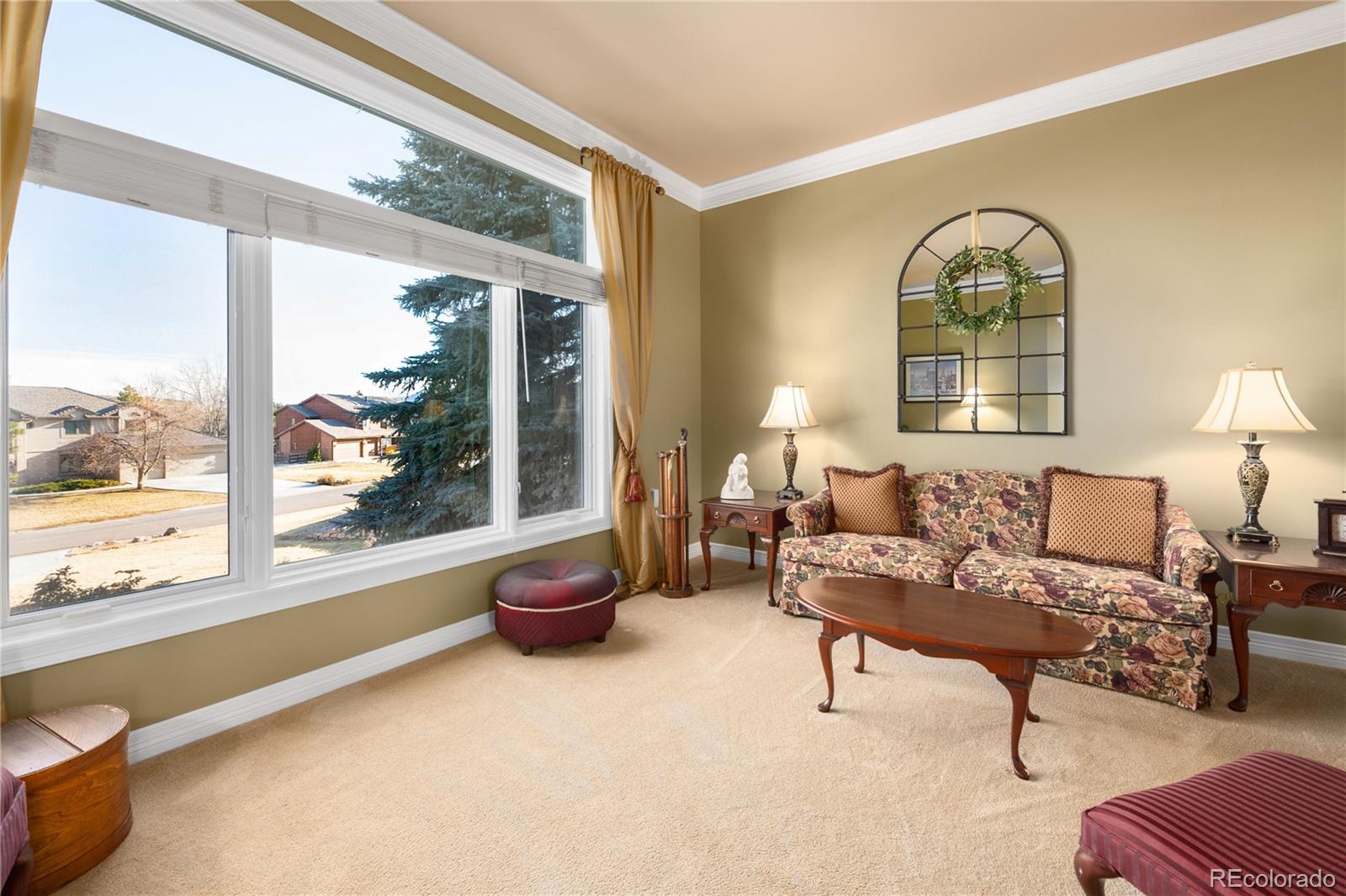 71 North Ranch Road Littleton, CO 80127 - Photo 10 of 40 a living room with furniture and a large window