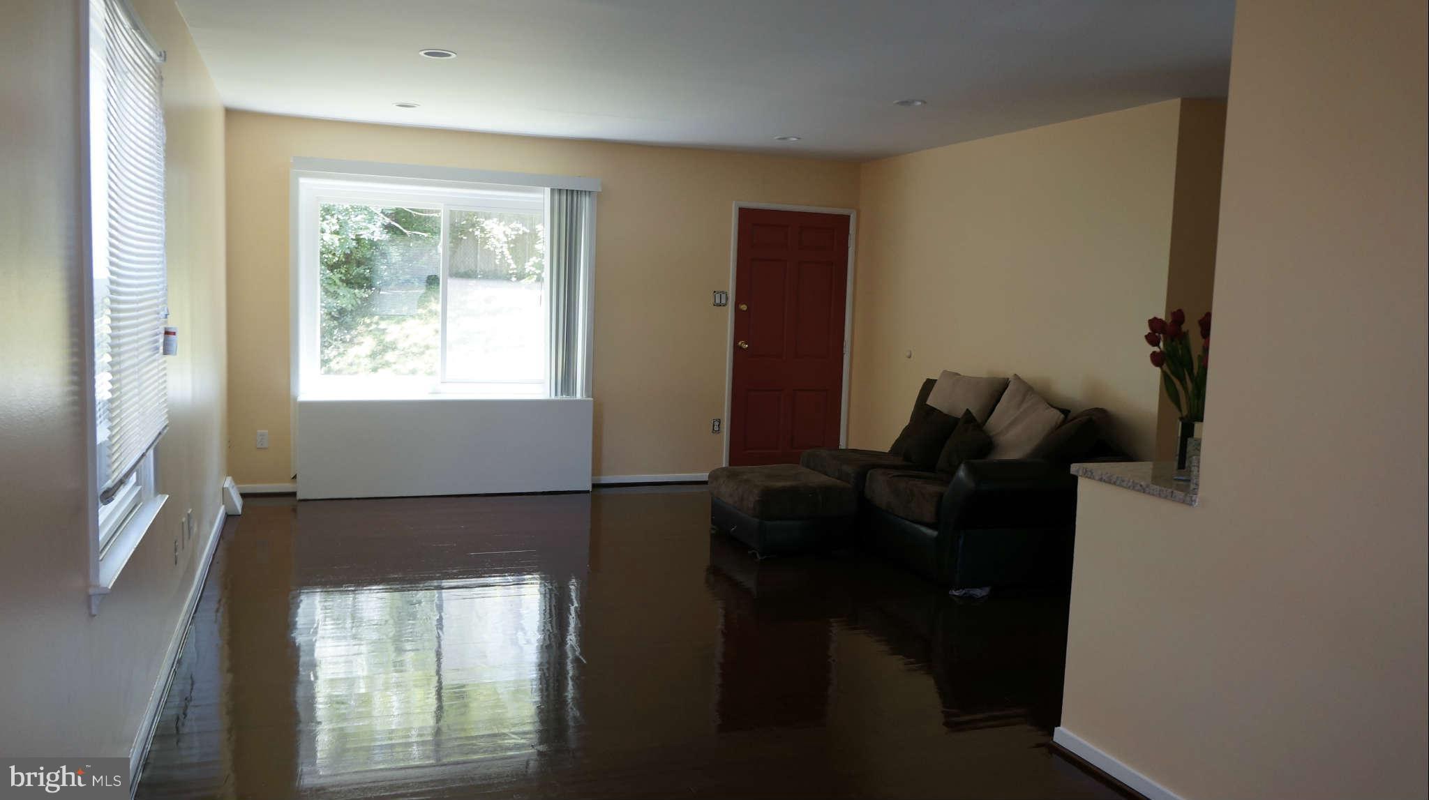 3802 Littleton Street Silver Spring, MD 20906 - Photo 14 of 28 a room with gym equipment and windows