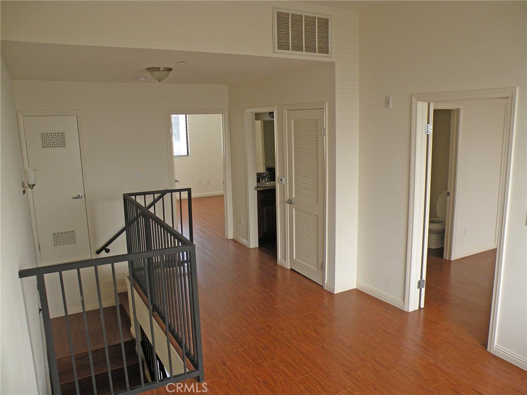 920 Central Avenue Riverside, CA 92507 - Photo 33 of 64 a view of a hallway with wooden floor and stairs