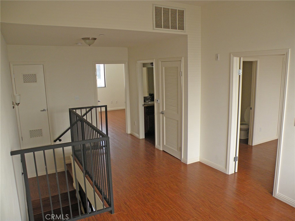 920 Central Avenue Riverside, CA 92507 - Photo 34 of 64 a view of a hallway with wooden floor and staircase
