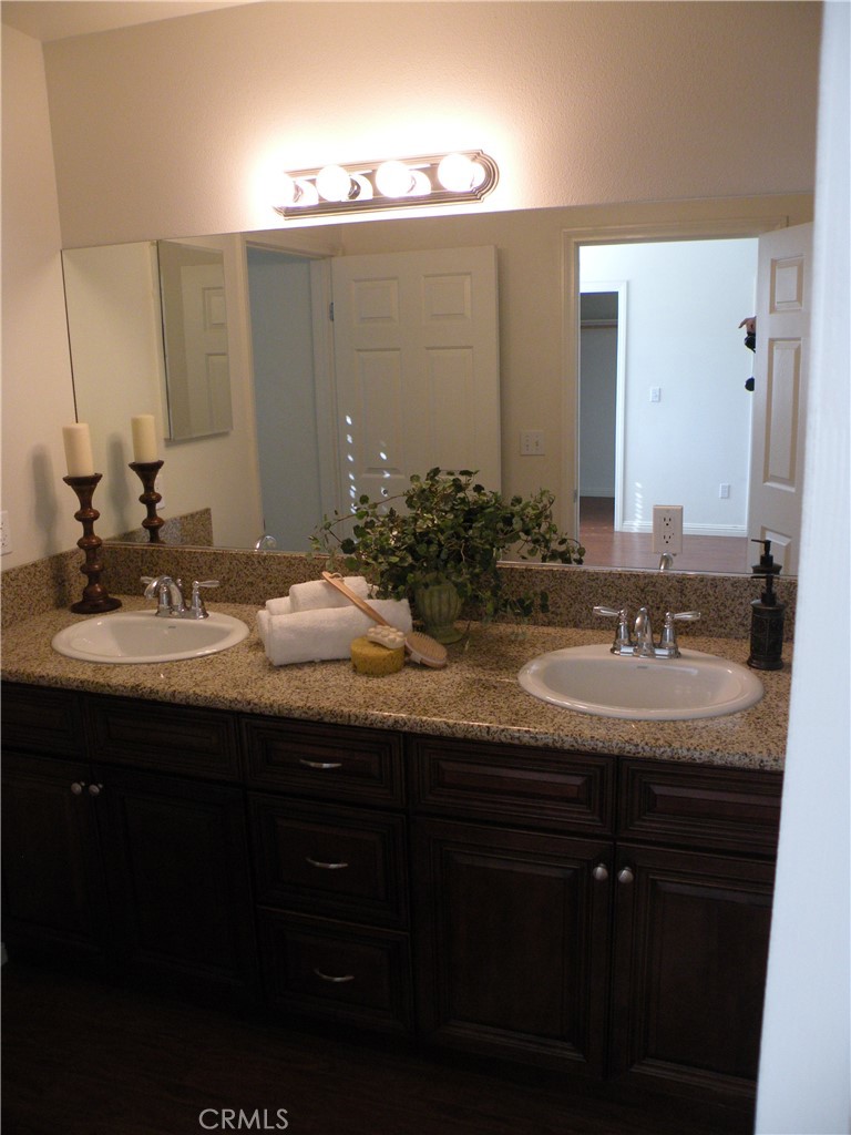 920 Central Avenue Riverside, CA 92507 - Photo 42 of 64 a bathroom with double sink and a mirror