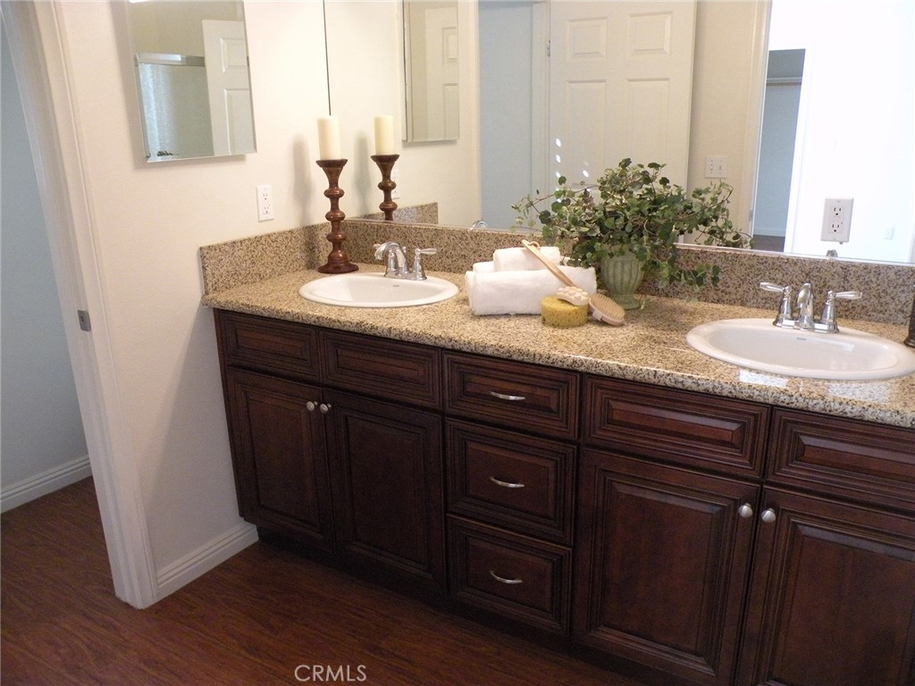 920 Central Avenue Riverside, CA 92507 - Photo 43 of 64 a bathroom with a granite countertop sink and a mirror