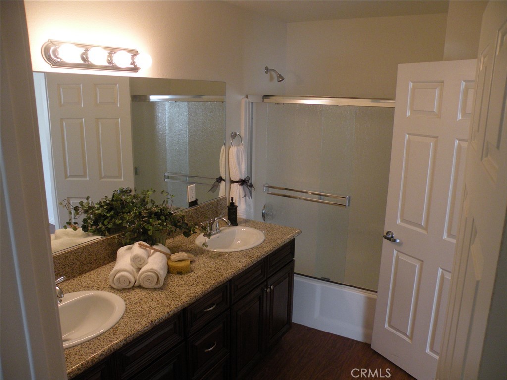 920 Central Avenue Riverside, CA 92507 - Photo 45 of 64 a bathroom with a sink double vanity granite and a mirror