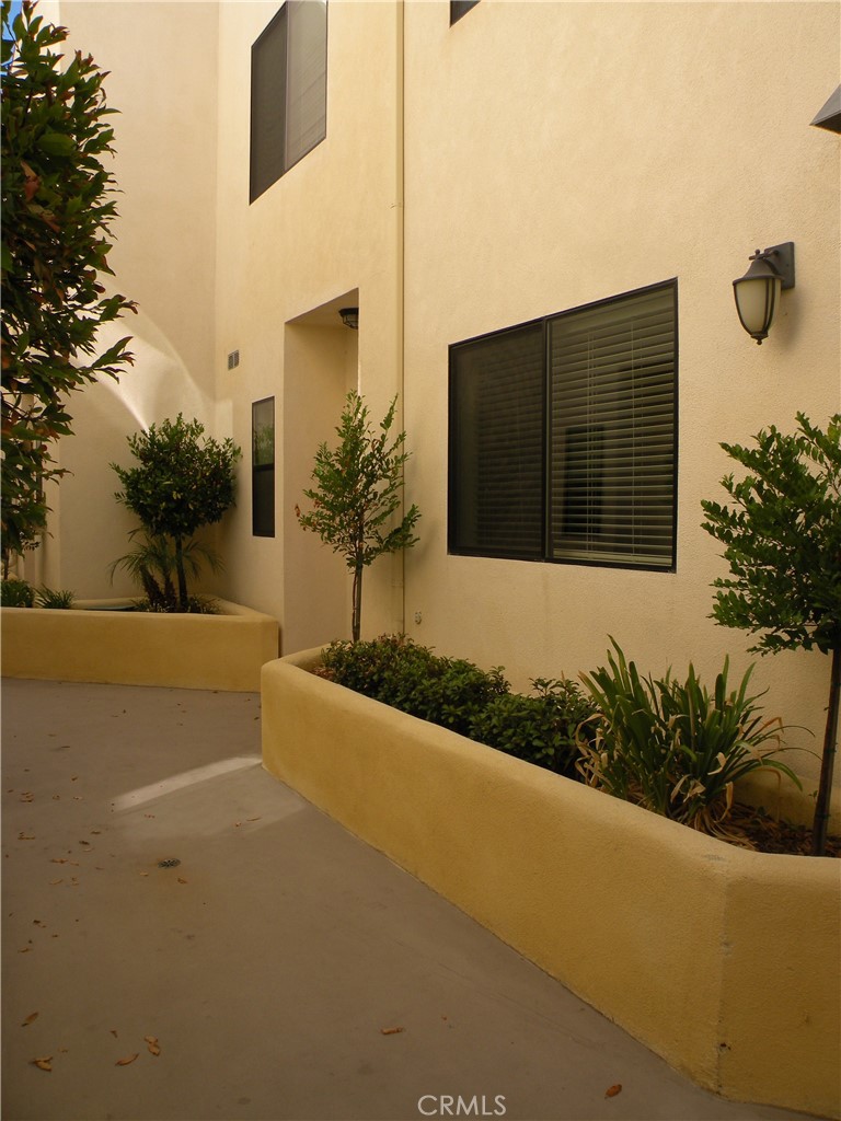 920 Central Avenue Riverside, CA 92507 - Photo 5 of 64 a front view of a house with a yard and garage