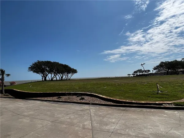 a view of a golf course with a lake view